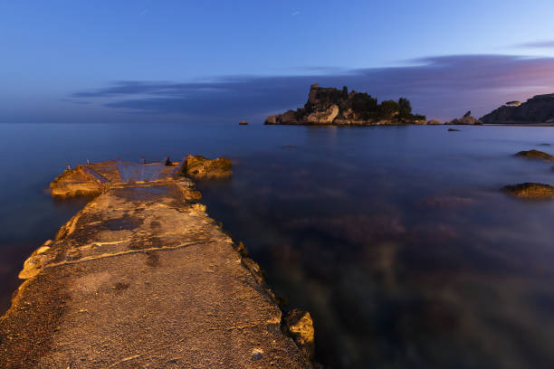 Isola Bella in Taormina (Sicily - Italy) at dusk. Taormina, Sicily: Isola Bella (Beautiful Island) seen at twilight; very long exposure. isola bella taormina stock pictures, royalty-free photos & images