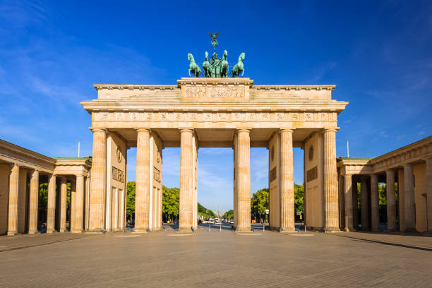 istock The Brandenburg Gate in Berlin at sunrise 895042720