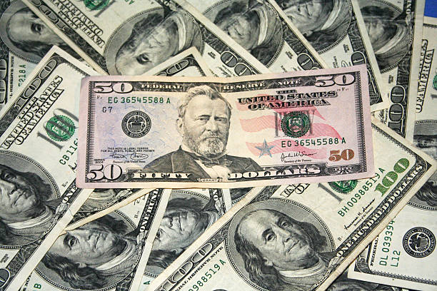 istock Fifty dollars among hundred dollar bills 89505125
