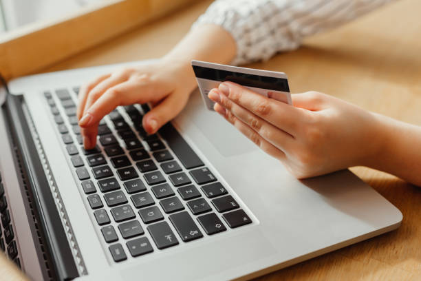 istock Woman with laptop shopping online. Payment Transaction at Computer using Credit Card 895053724