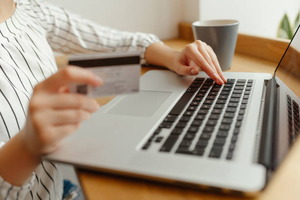 istock Woman with laptop shopping online. Payment Transaction at Computer using Credit Card 895053738