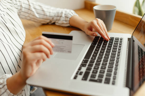 istock Woman with laptop shopping online. Payment Transaction at Computer using Credit Card 895053766
