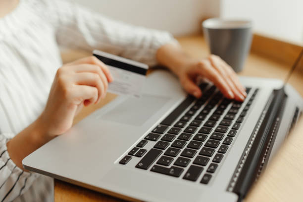 istock Woman with laptop shopping online. Payment Transaction at Computer using Credit Card 895054062