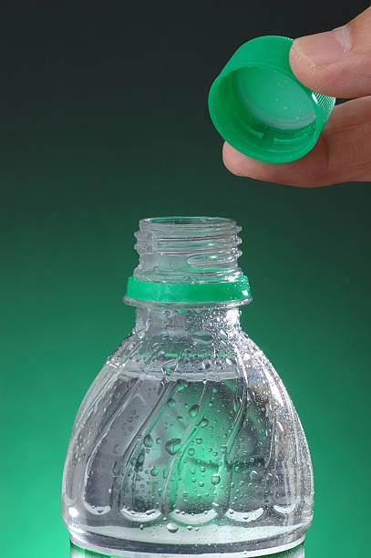 open bottled water - water bottle cap bildbanksfoton och bilder