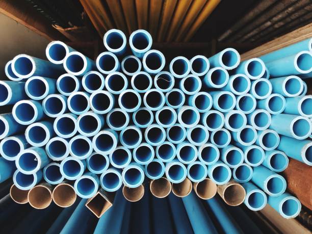 istock PVC pipes stacked in factory. 895058910