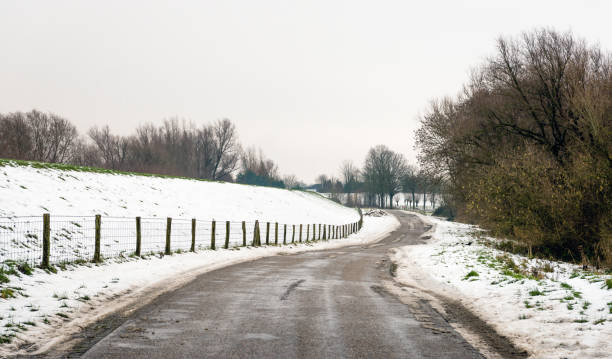 istock Meandering country road in wintertime 895061466