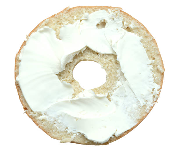istock bagel with sesame and cream cheese isolated on white background. top view 895064446