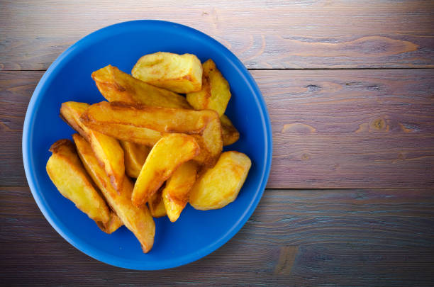 istock fry potatoes on a wooden background 895066492