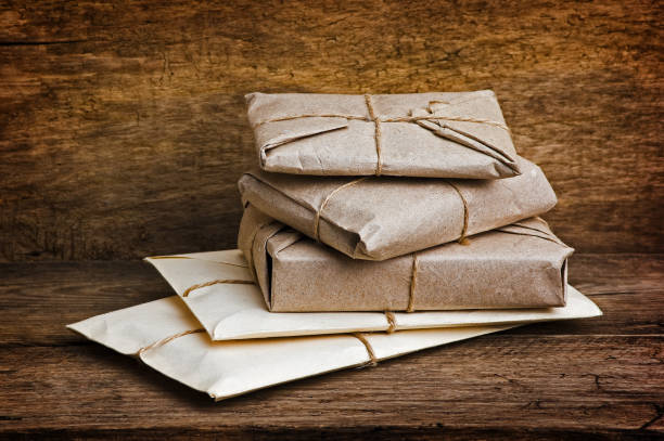istock Postage on the background of an old board 895068788