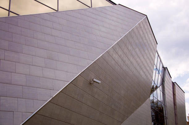 istock Perspective view of the modern building facade with watching camera on the wall 895071608