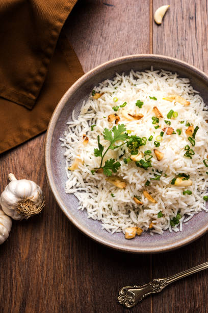 istock Garlic fried rice - cooked white basmati rice fried with garlic and served with yellow dal, popular indian recipe 895072122