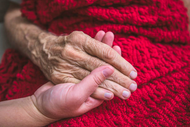 istock Hospice Nurse visiting an elderly male patient 895072376