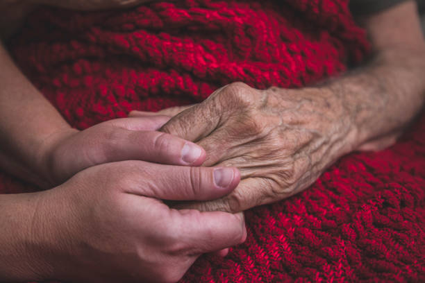 istock Hospice Nurse visiting an elderly male patient 895072378