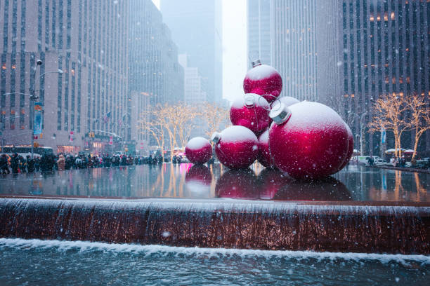 New York City, Unites States - December, 9th, 2017. Sixth avenue with Christmas decorations, New York City landmark at snowfall in winter
