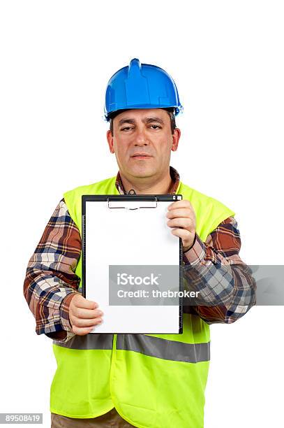 Trabalhador Da Construção Civil Mostrando Um Bloco Vazio - Fotografias de stock e mais imagens de Adulto