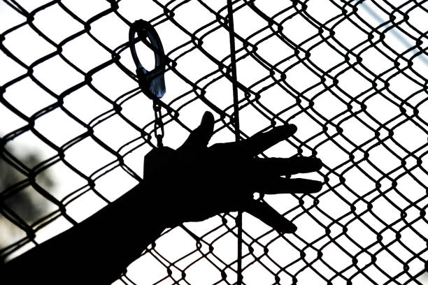 Behing the  barriers.
