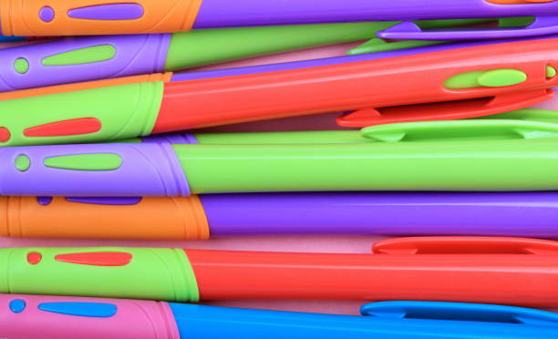 many Ball Pen on Pink Background stock photo