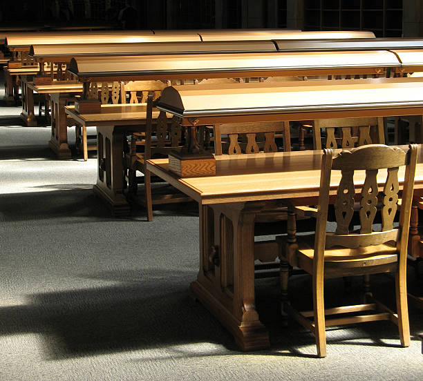 istock Wood tables and chairs in a library 89508846