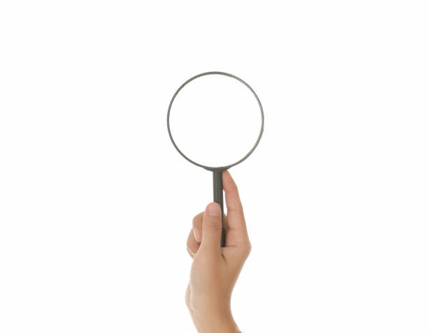 istock Hand holding magnifying glass isolated white background 895088582