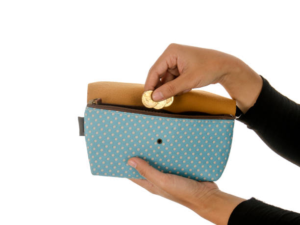 istock women put money into the wallet 895096228