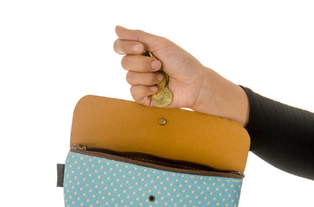 istock women put money into the wallet 895100648