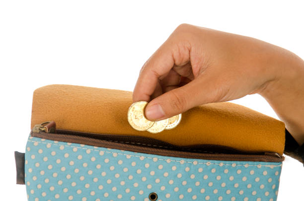 istock women put money into the wallet 895100658