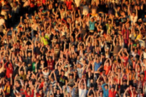 istock Blurred crowd of spectators in a stadium 895119700