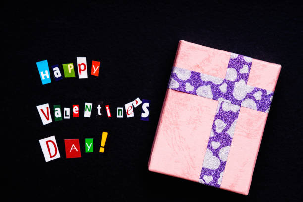 istock Text happy Valentine`s day made with carved letters and gift box 895134818