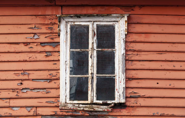 Old red wooden wall with window