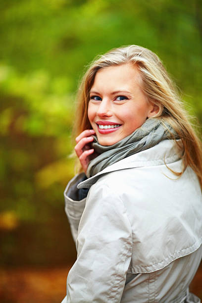 istock young woman looking back and smiling 89514455