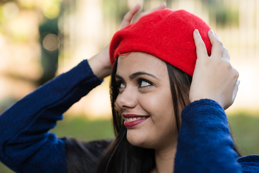 Portrait of atracctive woman wearing a red beret
