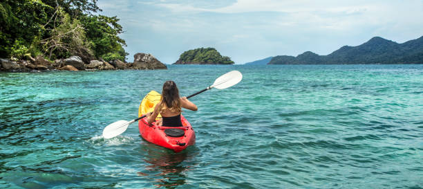 istock a girl on a canoe 895169284