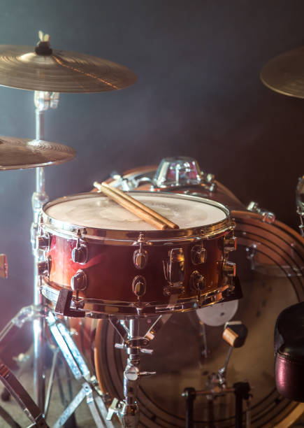 istock musical instruments drum kit, flash of light, a beautiful light in the background with copy space 895174118
