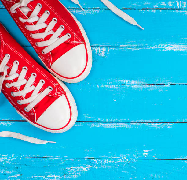 istock pair of red textile sneakers with white laces 895194014