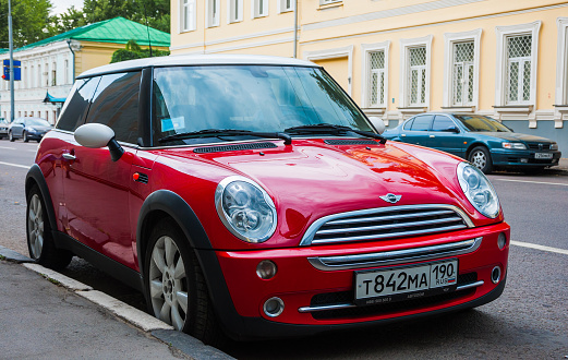 Moscow, Russia - July, 2011: Red Mini Cooper parked at the roadside