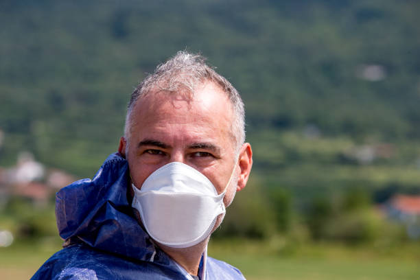 istock Portrait of a Researcher Wearing Protective Mask 895234232