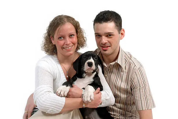 Photo of Young couple and puppy