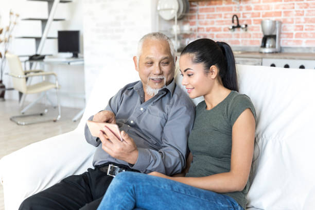 istock Father and daughter sitting at home and resting 895263136