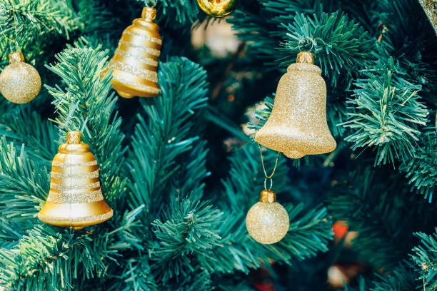 istock Decorated golden bell on Christmas tree 895263210