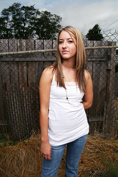 istock Blonde by the Fence 89526884