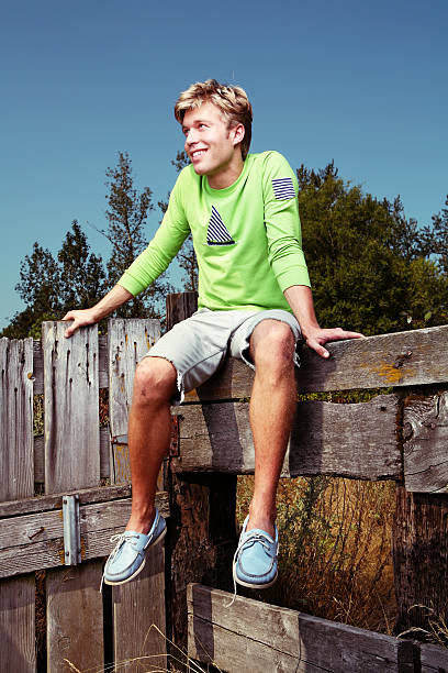 istock Rural Blonde Man Sitting on Fence 89527013