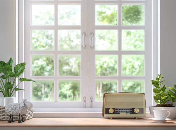 Wood shelf located by the window 3d rendering image Wood shelf located by the window 3d rendering image.Decorate with vintage radio.There are white wood window  look out to see the nature decorated window stock pictures, royalty-free photos & images