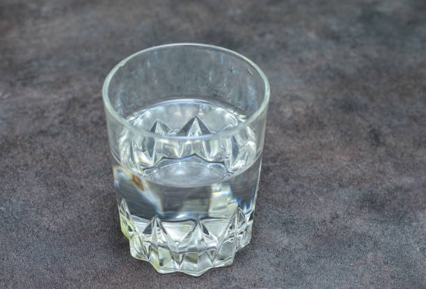 istock glass of water on black table 895278558