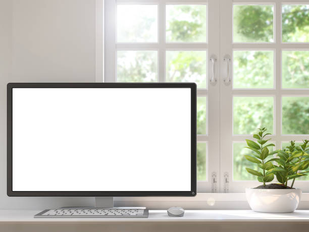 istock Work desk located by the window with a blank computer monitor 3d rendering image 895278596