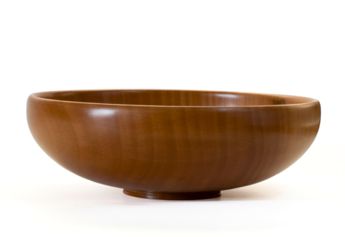 Handmade wooden bowl isolated on white with clipping path