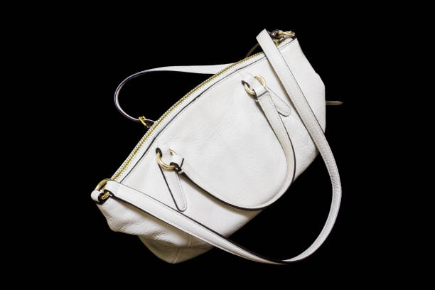 istock women's handbag isolated on black background 895282904