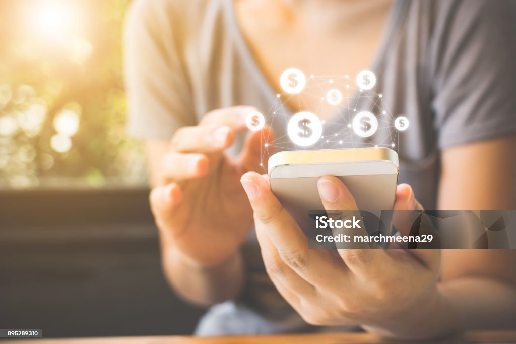 Woman hand using mobile phone with online transaction application, Concept ecommerce and internet investment Woman hand using mobile phone with online transaction application, Concept e-commerce and internet investment Mobile Phone Stock Photo