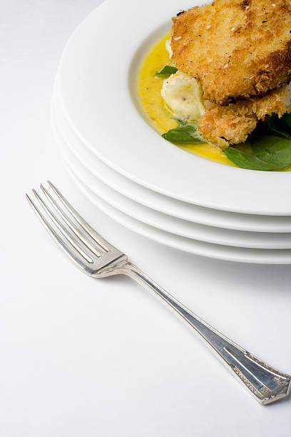 chicken schnitzel, mit schrägen antiken fork - mashed potato food staple vertical color image stock-fotos und bilder