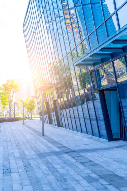 istock Square floor tile and modern architectural landscape glass and exterior wall background 895312356