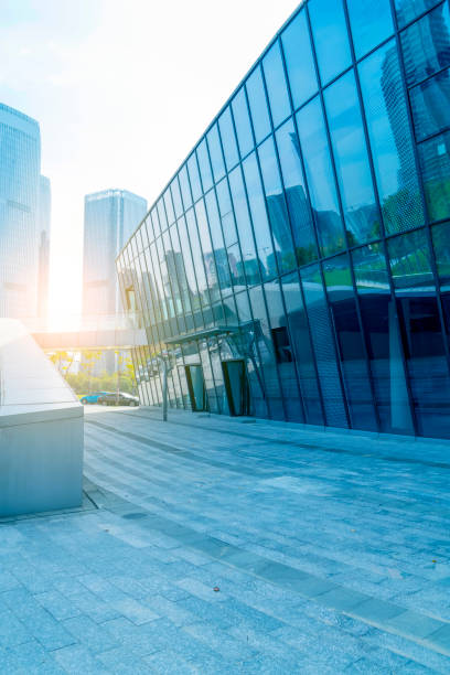 istock Square floor tile and modern architectural landscape glass and exterior wall background 895312634